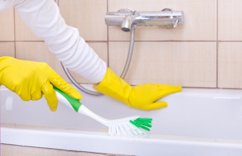Professional carpet cleaner treating a stair carpet in SE15