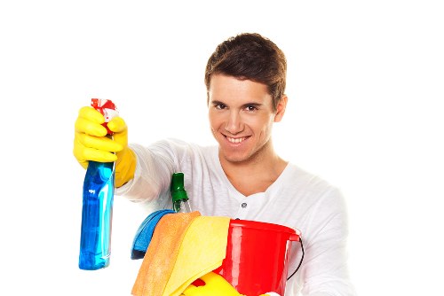 Cleaning team following safe procedures in a carpeted room